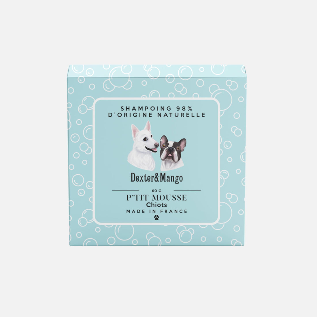 Shampoing solide P’tit Mousse de Dexter & Mango posé sur un support en bois avec pictogrammes naturels